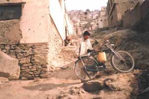 Carrying water home in Kabul.