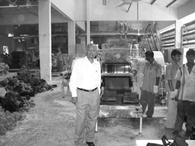 Rajendra Gandhi in his Rubber factory, India