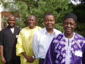 John Bangura (left) in Caux with (from left to right): Inspector-General of Police Brima Acha Kamara, Chief of the Defence Staff Maj-Gen Sam Mbomah, and Paramount Chief Massa Yeli Tham II of Makari Gbanti Chiefdom.