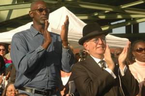 Black and white men applaud