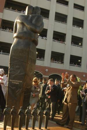 Rev. Tee Turner rejoices at unveiling of Reconciliation Statue. Karen Elliott-Greisdorf Photography