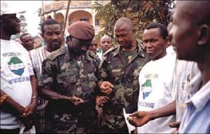Representatives of the Sierra Leone Military Brigade in Makeni lead Christian and Muslim prayers after a reconciliation